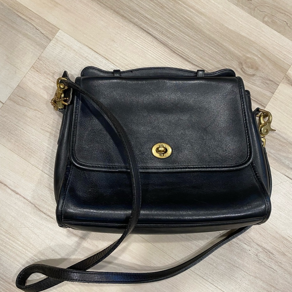 Coach Black Leather Shoulder Bag with Adjustable Strap and Flap Closure